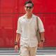 featuring-man-wearing-glasses-white-shirt-beige-shorts-walking-street-with-red-walls (1) (1)